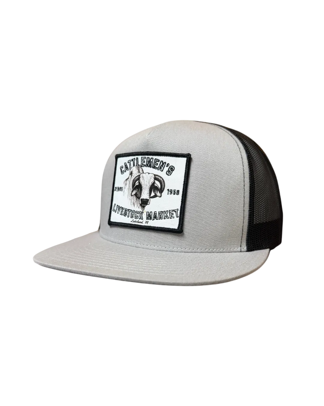 A light gray and black trucker hat featuring a rectangular front patch with a black ram skull logo and the text 'CATTLEMEN'S LIFETIME .